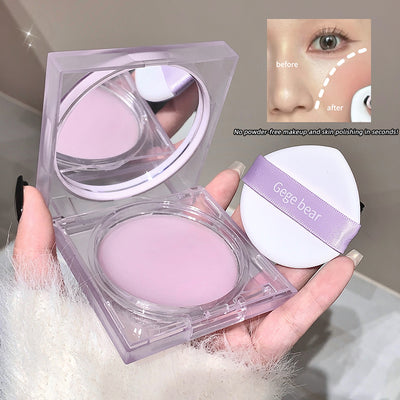 Purple compact powder with mirror and 'Gege bear' branding, held by a hand.