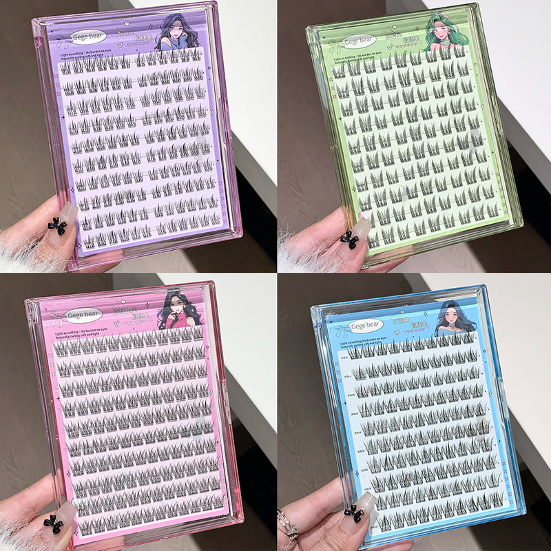 Four different colored packaging cases for false eyelashes held by a hand.