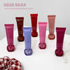 Collection of GEGE BEAR lip balms on a white surface with a light gray background.