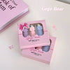 Pink packaging of Gege Bear lip mud box with three small bottles on a light pink background.