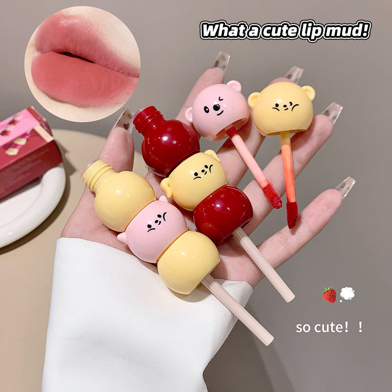 Cute lip mud products with cartoon bear faces on a hand, labeled 'What a cute lip mud!'.