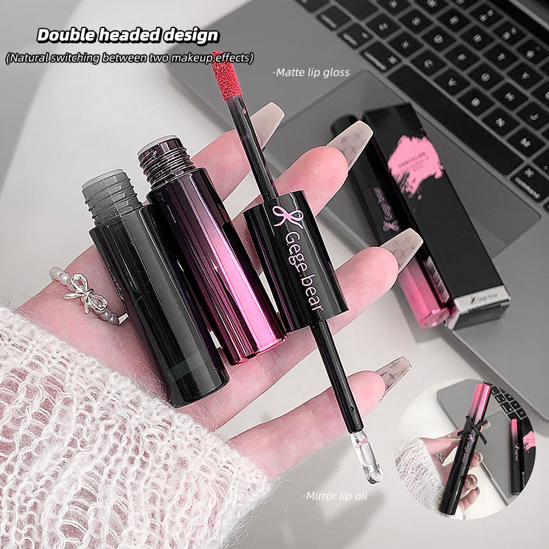 Lip gloss with double-ended design held by a hand, with laptop in background