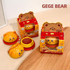 Two GEGE BEAR toys with their packaging on a wooden surface.