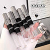 Set of GEGE BEAR lip glosses held by a hand with a blurred background