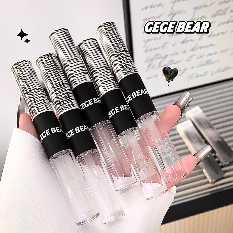 Set of GEGE BEAR lip glosses held by a hand with a blurred background