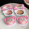 Four compact makeup cases with bear-shaped covers on a white surface, branded 'Gege bear'.