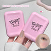 Two pink makeup compact cases with 'Cige bear' branding, held by a hand.
