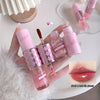 Set of pink lip glosses with a close-up of lips wearing the product on a white surface.