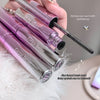 Pink mascara with 'Gege bear' branding held by a hand, on a soft white background.