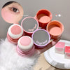 Pink makeup products with 'Geege bear' branding held by a hand.