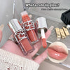 Lip gloss with silver cap held in hand, close-up of lip with gloss applied.