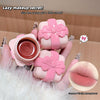 Pink makeup product with a bow design held by a hand, with text about a 'lazy makeup secret'.