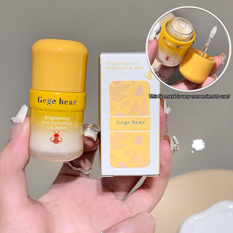 Yellow lip mask with packaging held by a hand, showing close-up details.