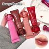 Lip balm tubes with 'GEGE BEAR' branding held by a hand, with a close-up of lips wearing the product.