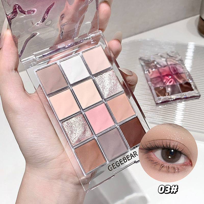 Makeup palette with various shades held by a hand, close-up of an eye wearing the product.