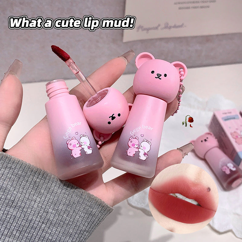 Pink lip mud with bear design held by a hand, with text 'What a cute lip mud!'.