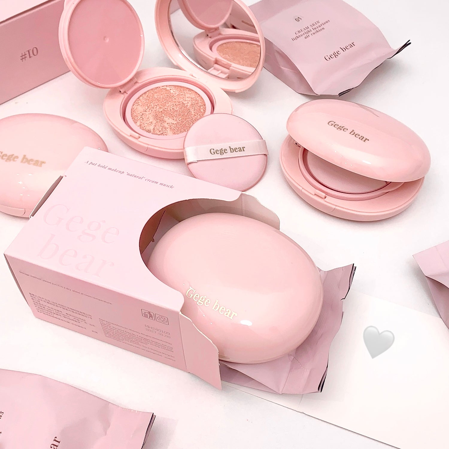 Pink cosmetic products with 'Gege bear' branding on a white background