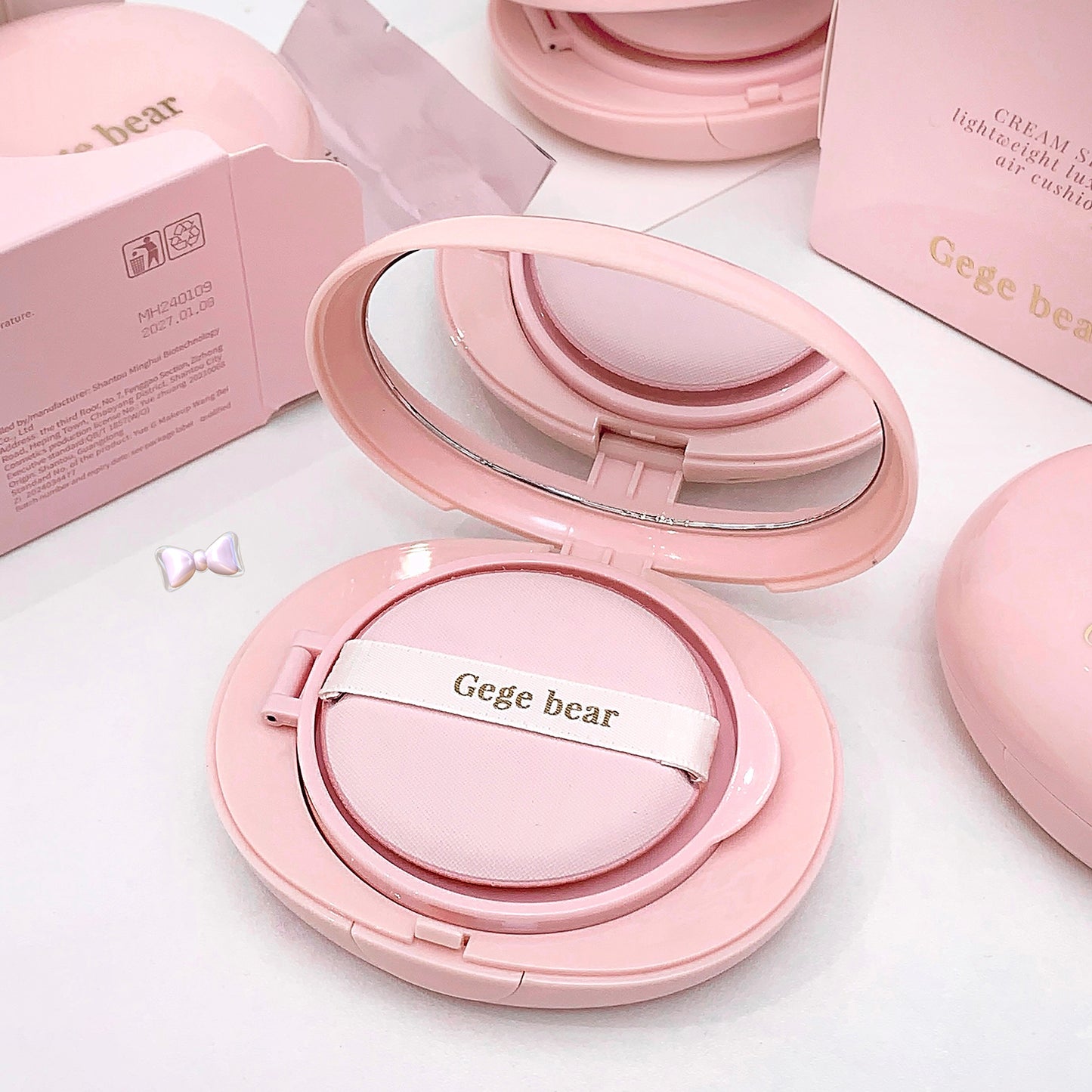 Pink Gege bear compact on a white background