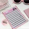 Set of false eyelashes in a pink case with sunglasses and a pink brush in the background.