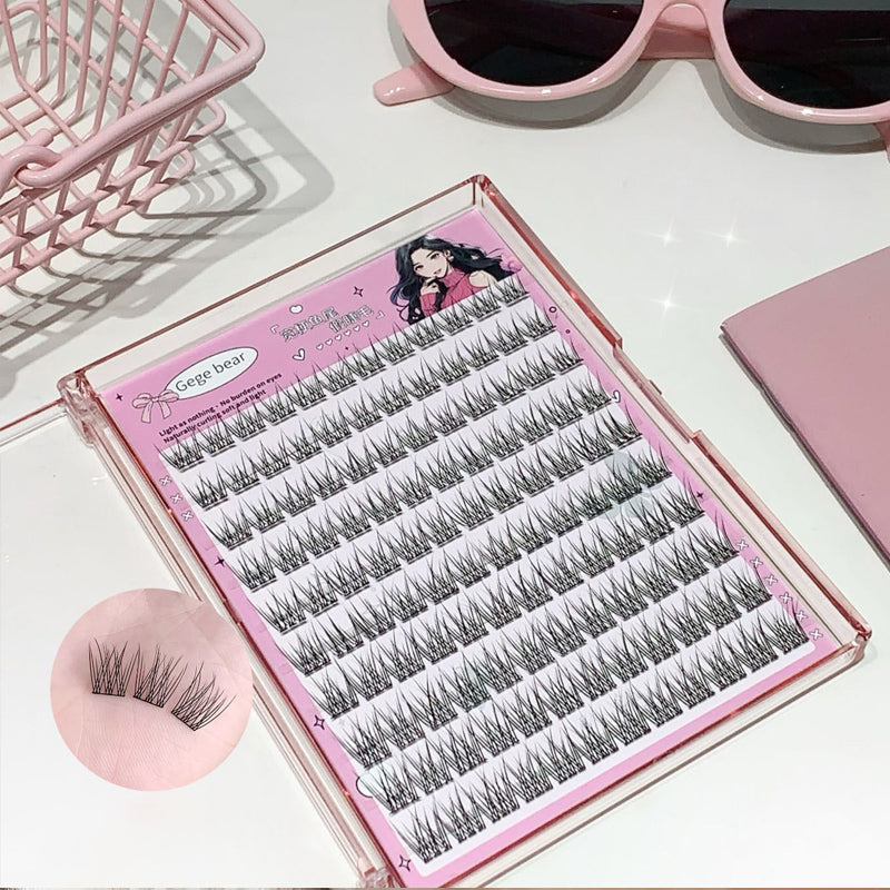 Set of false eyelashes in a pink case with sunglasses and a pink brush in the background.