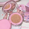 Pink cosmetic compact with beige powder, brand 'Giggle Bear' visible