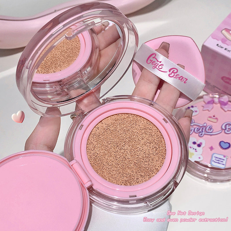 Pink cosmetic compact with beige powder, brand 'Giggle Bear' visible