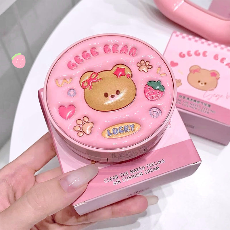 Pink cosmetic product with bear design held by a hand, brand 'GeeG Bear' visible