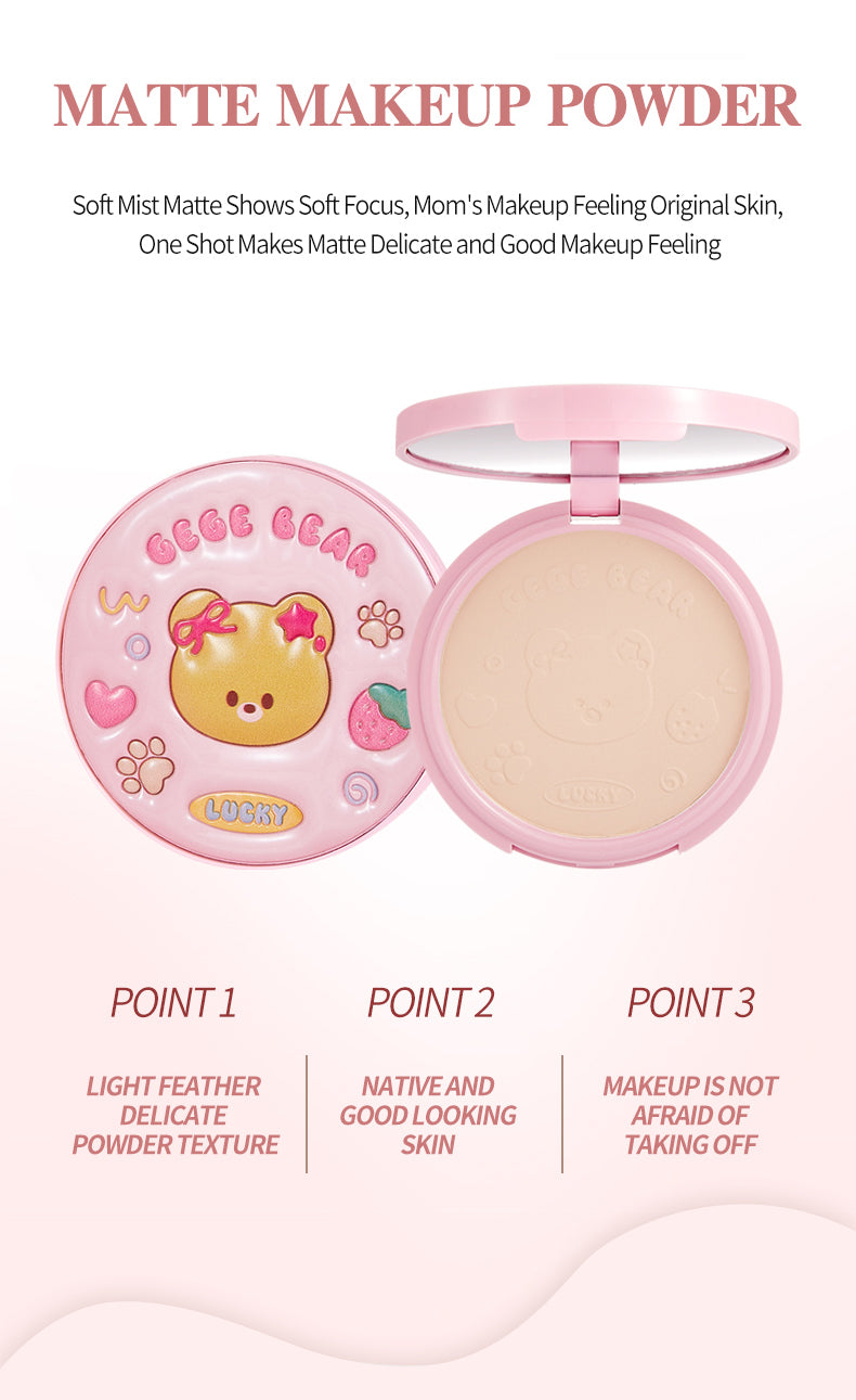 Pink makeup powder compact with cartoon design on a white background