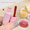 Pink lip gloss with applicator on a beige background
