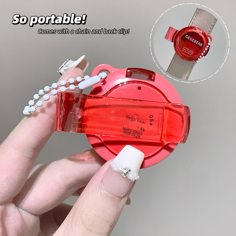 Red watch case with chain and back clip held by a hand, with inset showing watch on wrist.