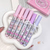 Set of pink and purple lip balms with bear designs on a white heart-shaped tray.