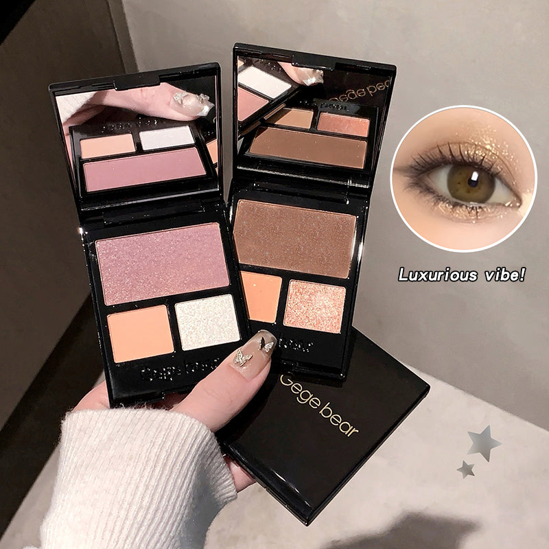 Makeup palette with eyeshadow shades held by a hand, close-up of eye wearing the makeup.