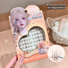 Eyelash packaging with a character illustration and text on a wooden surface
