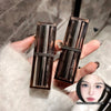 Two makeup products held by a hand with a blurred face inset on a textured background