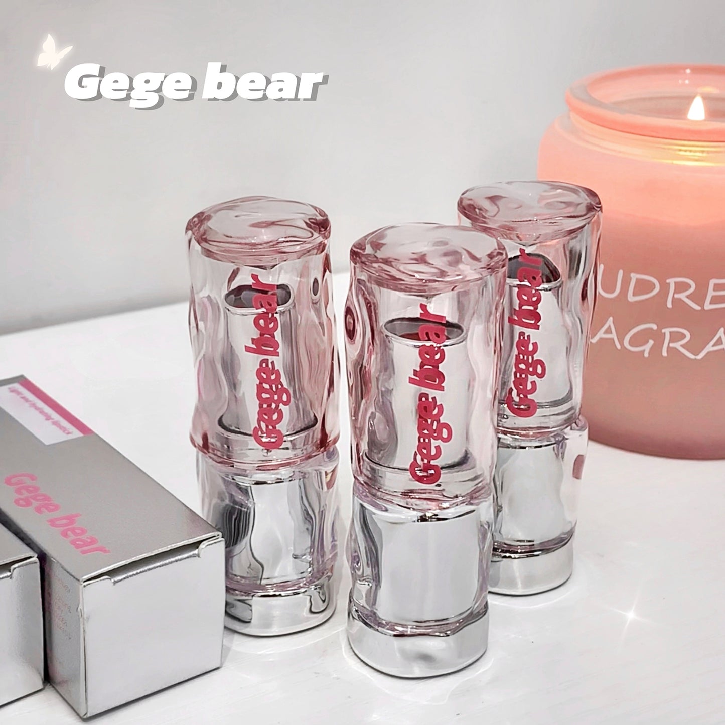 Gege bear vape devices with a box and candle in the background