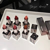 Set of lipsticks with visible brand 'Gege bear' on a white surface.