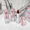 Set of Gege Bear lipsticks on a white surface with a mirror in the background