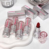 Set of Gege bear lip products including lipsticks and lip glosses on a white surface.