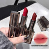 Three red lipsticks with brown cases held by a hand, with an inset of lips wearing the lipstick color.