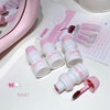 Set of white nail polish bottles with pink caps on a white surface with a pink mirror and text in the background.