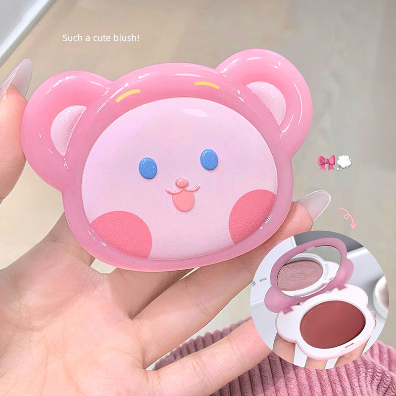 Cute pink bear-shaped compact mirror held by a hand