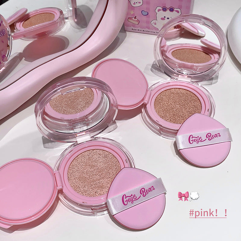 Pink makeup compacts with 'Gige Bear' branding on a white surface.
