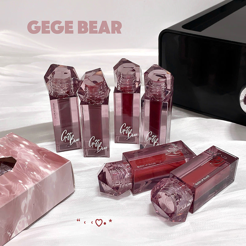 Gege Bear lip gloss bottles on a white background
