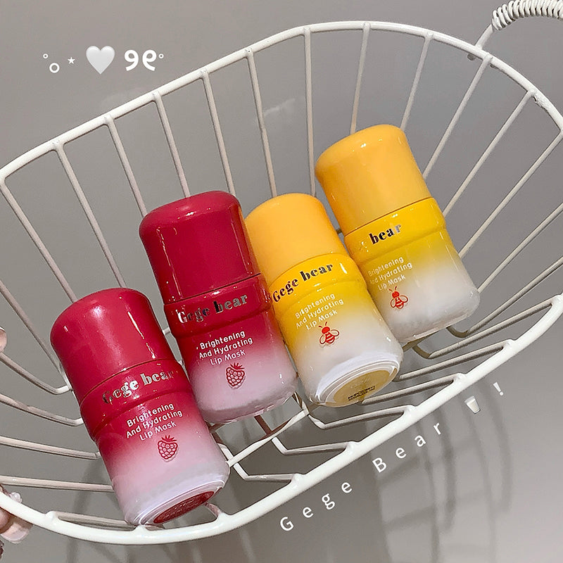 Four lip masks with different colors on a white wire rack, featuring the brand 'Gege Bear'.