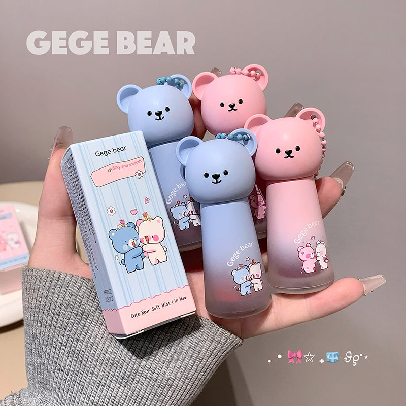 Two bear-shaped bottles and their packaging held in a hand, with 'GEGE BEAR' branding.