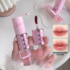 Pink lip gloss with checkered design held by a hand, surrounded by close-up images of lips.
