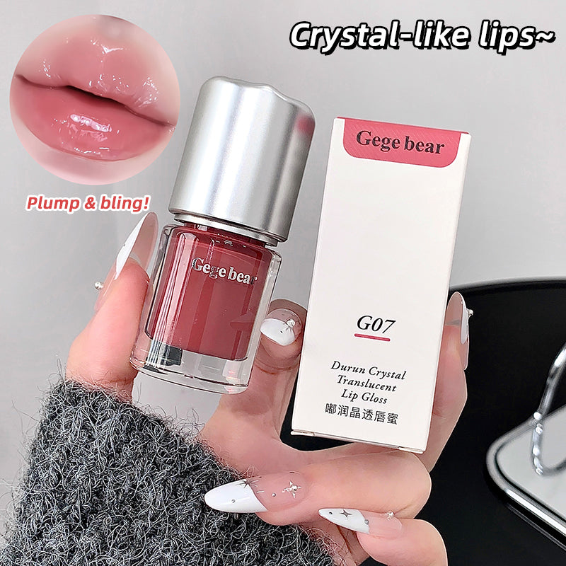 Lip gloss with packaging labeled 'Gege bear' held by a hand, showing close-up of lips with 'Crystal-like lips~' text.