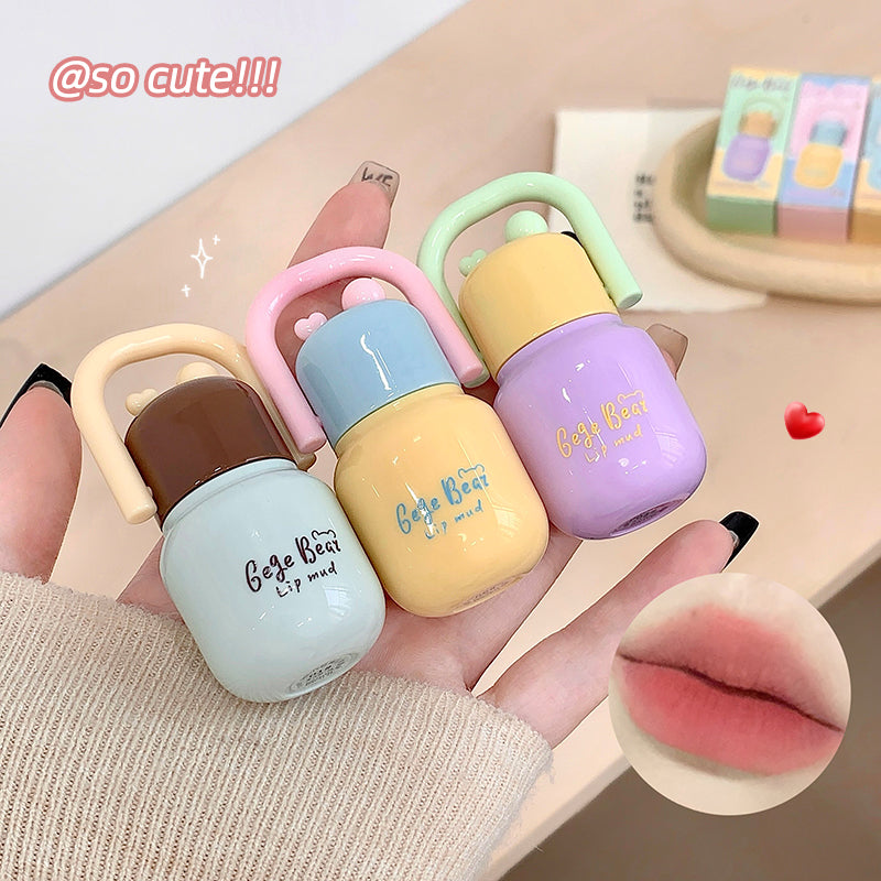 Set of colorful lip balm containers held by a hand, with a heart and 'so cute!!!' text above.