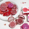 Pink makeup products with 'GEGEBEAR' branding on a white surface.