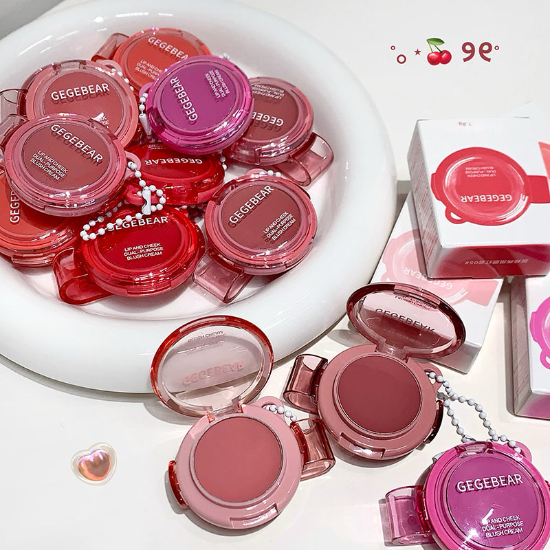 Pink makeup products with 'GEGEBEAR' branding on a white surface.